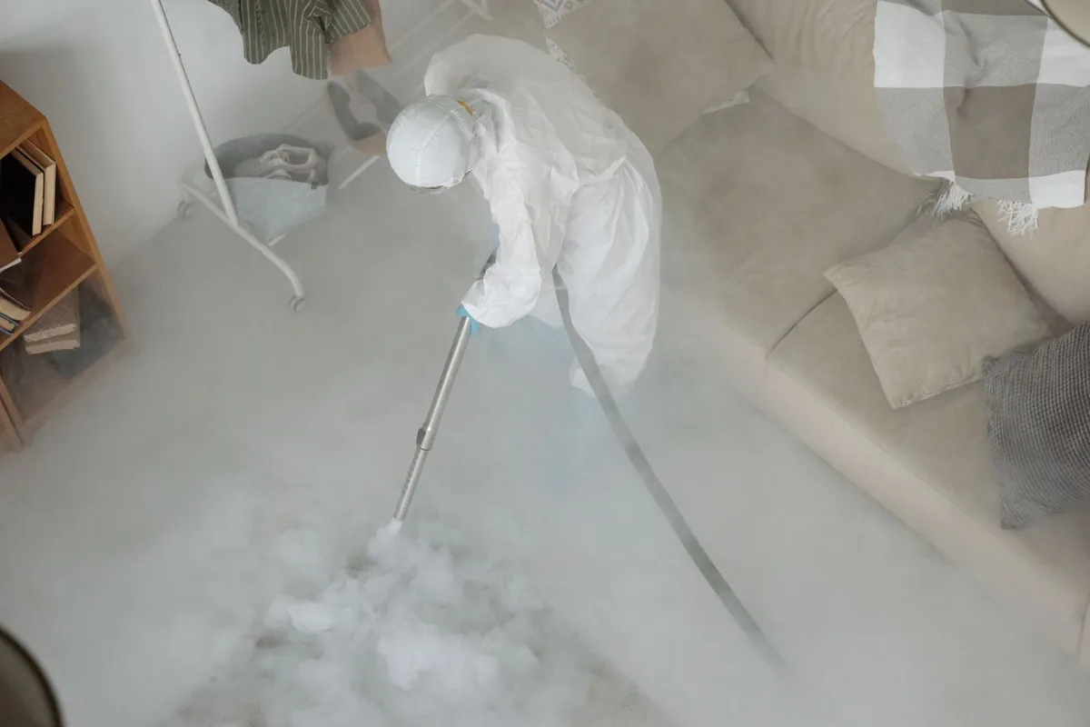 Biohazard cleanup technician in protective equipment, Farmington, MO